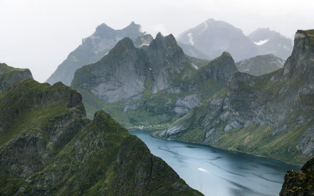 a mountain range with a body of water surrounded by mountains
